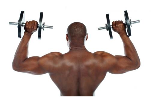 black man working out with dumbbells