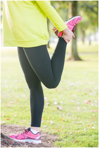 girl doing leg exercise in park to burn fats from her legs