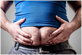 man holding his excess belly fats with two hands