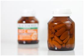 weight loss tablets in two glass bottles 